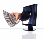 a computer flat screen monitor with money